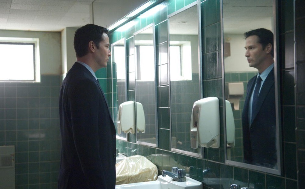 Keanu looking in a mirror